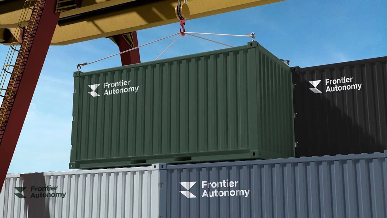 Frontier Autonomy brand applied to industrial containers in brand color system
